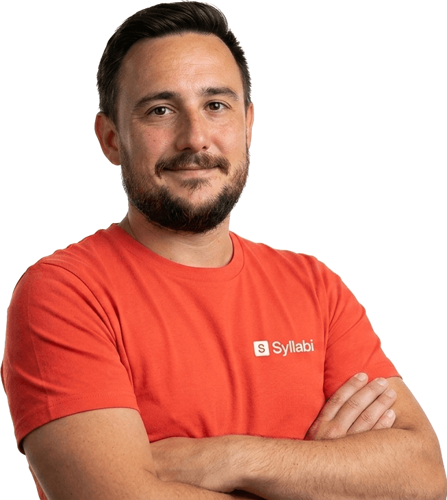 Mr. Stacey Dixon, arms folded, wearing a Syllabi T-shirt